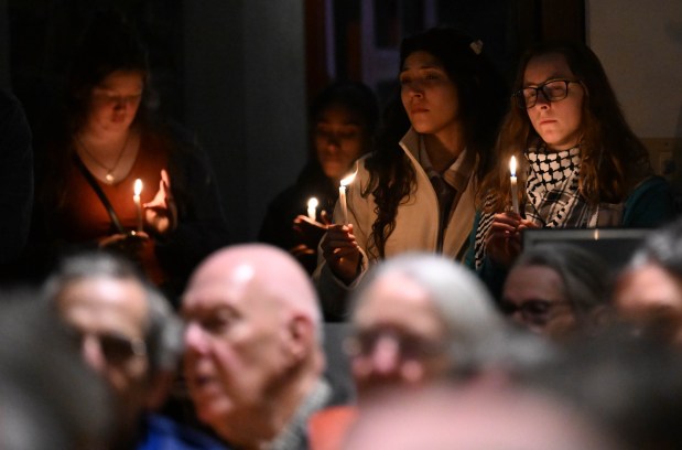 People attend a vigil for Renee Nicole Good, the woman shot and killed by a federal immigration agent in Minneapolis, on Friday, Jan. 9, 2026, at the Cathedral Church of the Nativity in Bethlehem.