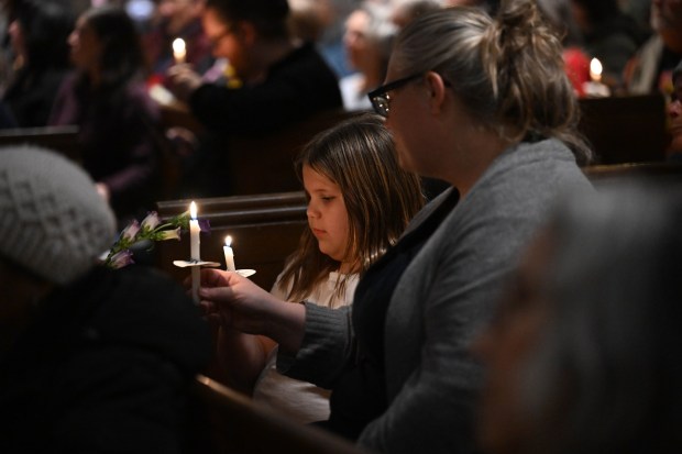 People attend a vigil for Renee Nicole Good, the woman shot and killed by a federal immigration agent in Minneapolis, on Friday, Jan. 9, 2026, at the Cathedral Church of the Nativity in Bethlehem.