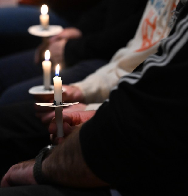 People attend a vigil for Renee Nicole Good, the woman shot and killed by a federal immigration agent in Minneapolis, on Friday, Jan. 9, 2026, at the Cathedral Church of the Nativity in Bethlehem.