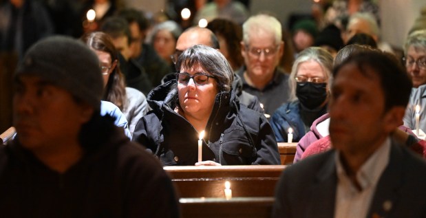 People attend a vigil for Renee Nicole Good, the woman shot and killed by a federal immigration agent in Minneapolis, on Friday, Jan. 9, 2026, at the Cathedral Church of the Nativity in Bethlehem.