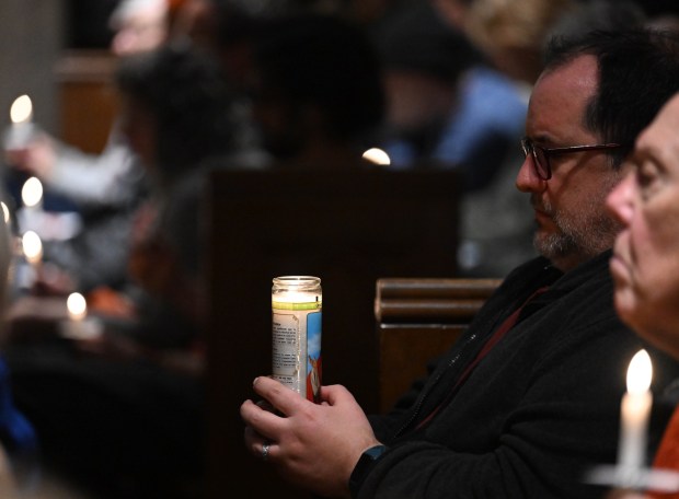 People attend a vigil for Renee Nicole Good, the woman shot and killed by a federal immigration agent in Minneapolis, on Friday, Jan. 9, 2026, at the Cathedral Church of the Nativity in Bethlehem.