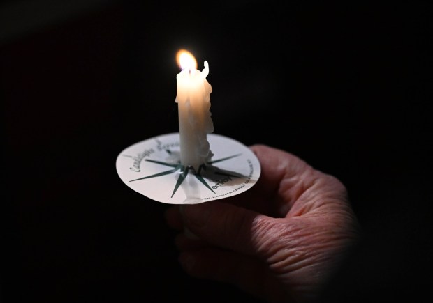 People attend a vigil for Renee Nicole Good, the woman shot and killed by a federal immigration agent in Minneapolis, on Friday, Jan. 9, 2026, at the Cathedral Church of the Nativity in Bethlehem.