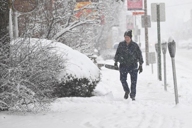 Dean G. Berg shovels the sidewalk in front of his law practice Saturday, Jan. 17, 2026, in Northampton. A winter storm dropped several inches of snow across the Lehigh Valley, leading to messy travel conditions.(Amy Shortell / The Morning Call)
