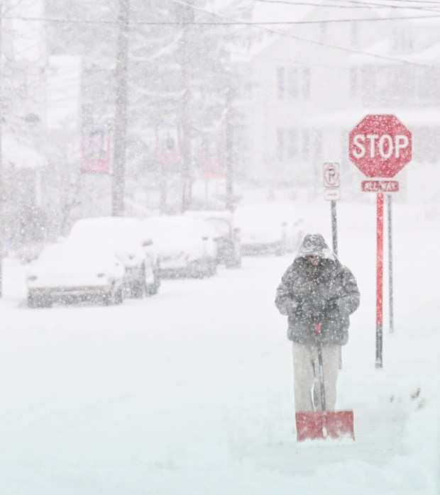 Pedestrians walk in the snow Saturday, Jan. 17, 2026, in Northampton. A winter storm dropped several inches of snow across the Lehigh Valley, leading to messy travel conditions.(Amy Shortell / The Morning Call)