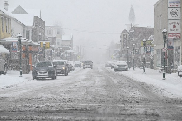 Main Street is covered in snow and slush Saturday, Jan. 17, 2026, in Northampton. A winter storm dropped several inches of snow across the Lehigh Valley, leading to messy travel conditions.(Amy Shortell / The Morning Call)