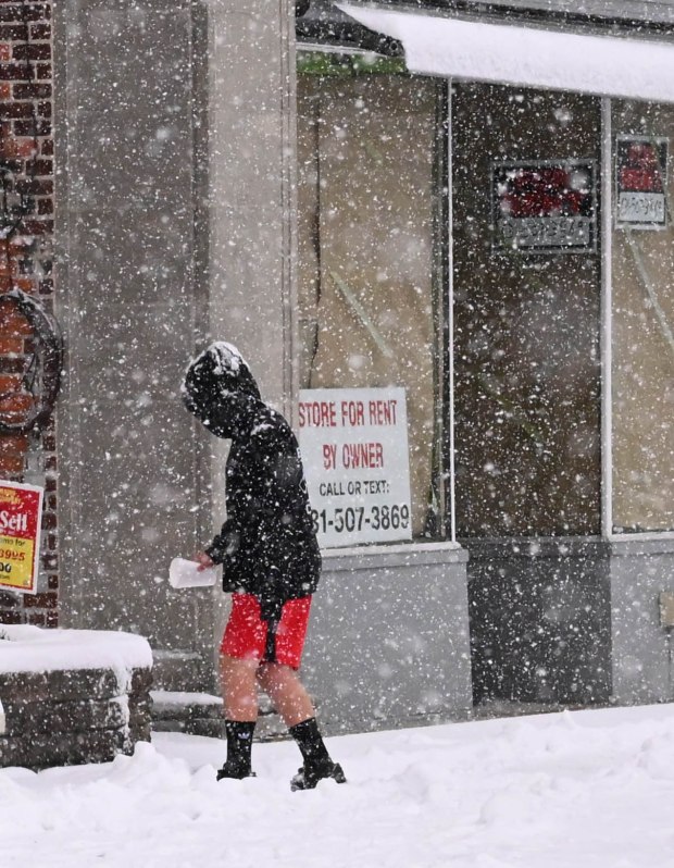 Pedestrians walk in the snow Saturday, Jan. 17, 2026, in Northampton. A winter storm dropped several inches of snow across the Lehigh Valley, leading to messy travel conditions.(Amy Shortell / The Morning Call)