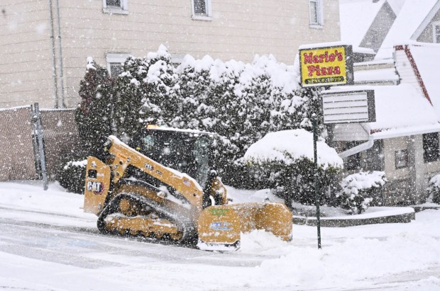 Large machinery is used to clear the parking lot of Mario's Pizza Saturday, Jan. 17, 2026, in Northampton. A winter storm dropped several inches of snow across the Lehigh Valley, leading to messy travel conditions.(Amy Shortell / The Morning Call)
