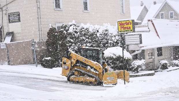 Large machinery is used to clear the parking lot of Mario's Pizza Saturday, Jan. 17, 2026, in Northampton. A winter storm dropped several inches of snow across the Lehigh Valley, leading to messy travel conditions.(Amy Shortell / The Morning Call)