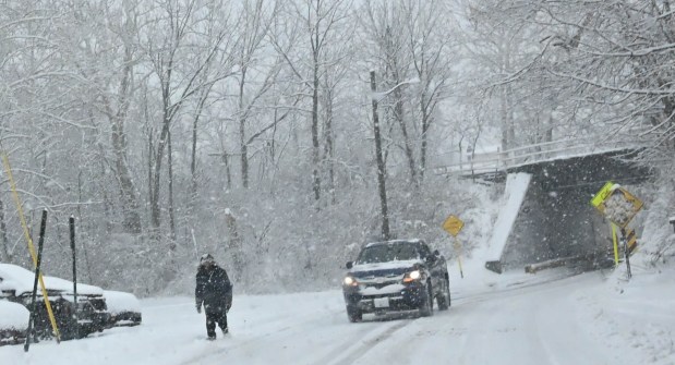 Pedestrians walk in the snow Saturday, Jan. 17, 2026, in Northampton. A winter storm dropped several inches of snow across the Lehigh Valley, leading to messy travel conditions.(Amy Shortell / The Morning Call)