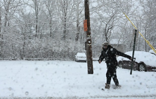 Pedestrians walk in the snow Saturday, Jan. 17, 2026, in Northampton. A winter storm dropped several inches of snow across the Lehigh Valley, leading to messy travel conditions.(Amy Shortell / The Morning Call)
