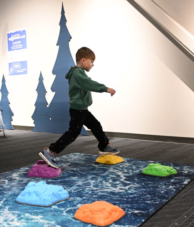 Henry Beck,5, plays with stepping stones Friday, Jan. 2, 2026, in the Winter Wonder Lab exhibit at the Da Vinci Science Center in Allentown. (Amy Shortell/The Morning Call)