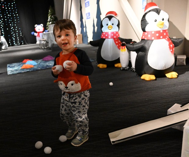 William Oplinger, 2,of Phoenixville, plays with snowballs in a tube maze  Friday, Jan. 2, 2026, in the Winter Wonder Lab exhibit at the Da Vinci Science Center in Allentown. (Amy Shortell/The Morning Call)