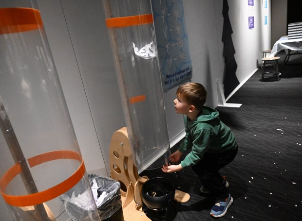 Henry Beck,5, watches as his snowflake flies in a tube Friday, Jan. 2, 2026, in the Winter Wonder Lab exhibit at the Da Vinci Science Center in Allentown. (Amy Shortell/The Morning Call)