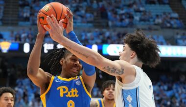 Feb 14, 2026; Chapel Hill, North Carolina, USA; Pittsburgh Panthers guard Omari Witherspoon (8) with the ball as North Carolina Tar Heels forward Zayden High (1) defends in the first half at Dean E. Smith Center. Mandatory Credit: Bob Donnan-Imagn Images