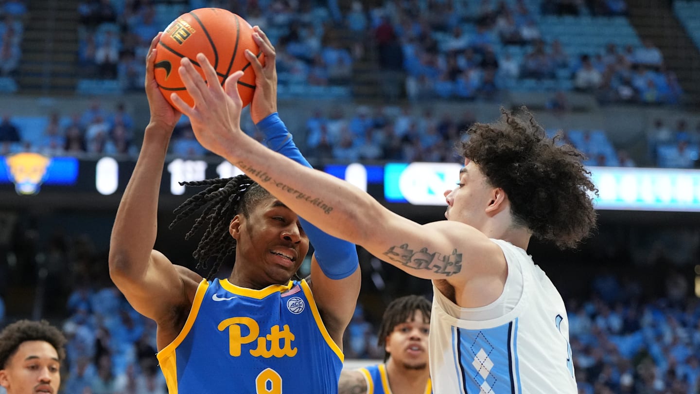 Feb 14, 2026; Chapel Hill, North Carolina, USA; Pittsburgh Panthers guard Omari Witherspoon (8) with the ball as North Carolina Tar Heels forward Zayden High (1) defends in the first half at Dean E. Smith Center. Mandatory Credit: Bob Donnan-Imagn Images