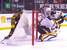 Brantford Bulldogs forward Charlie Paquette tries to wrap the puck around the net against the Erie Otters during OHL action on Feb. 13 at the TD Civic Centre in Brantford.