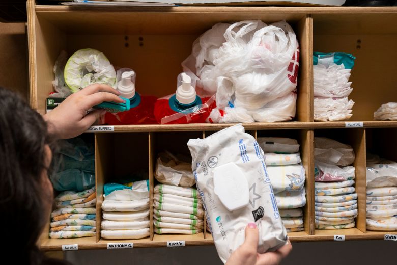 Ciara Manning, director of the Emmaus Active Learning Centers, organizes diapers.