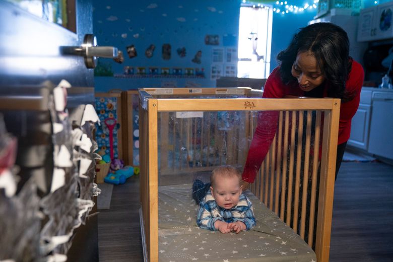 A staff member cares for an infant at Active Learning Centers Emmaus.