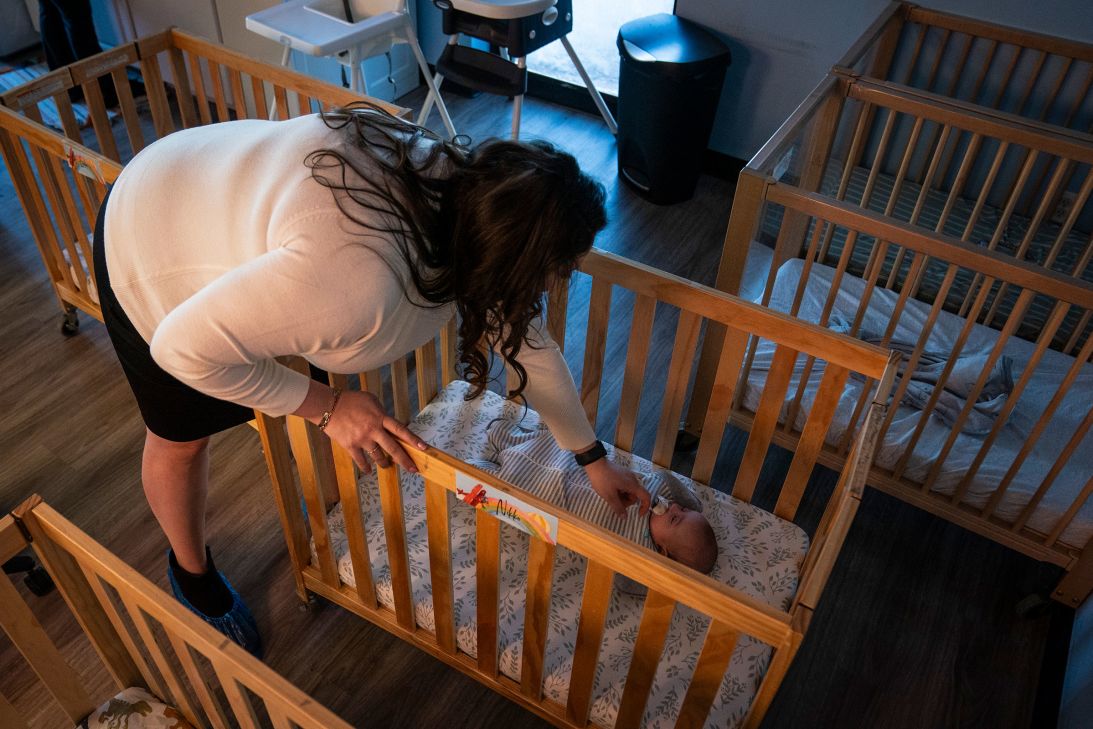 Ciara Manning, director of Active Learning Centers Emmaus, checks on a infant.