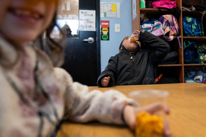 Children eat crackers during snack time.