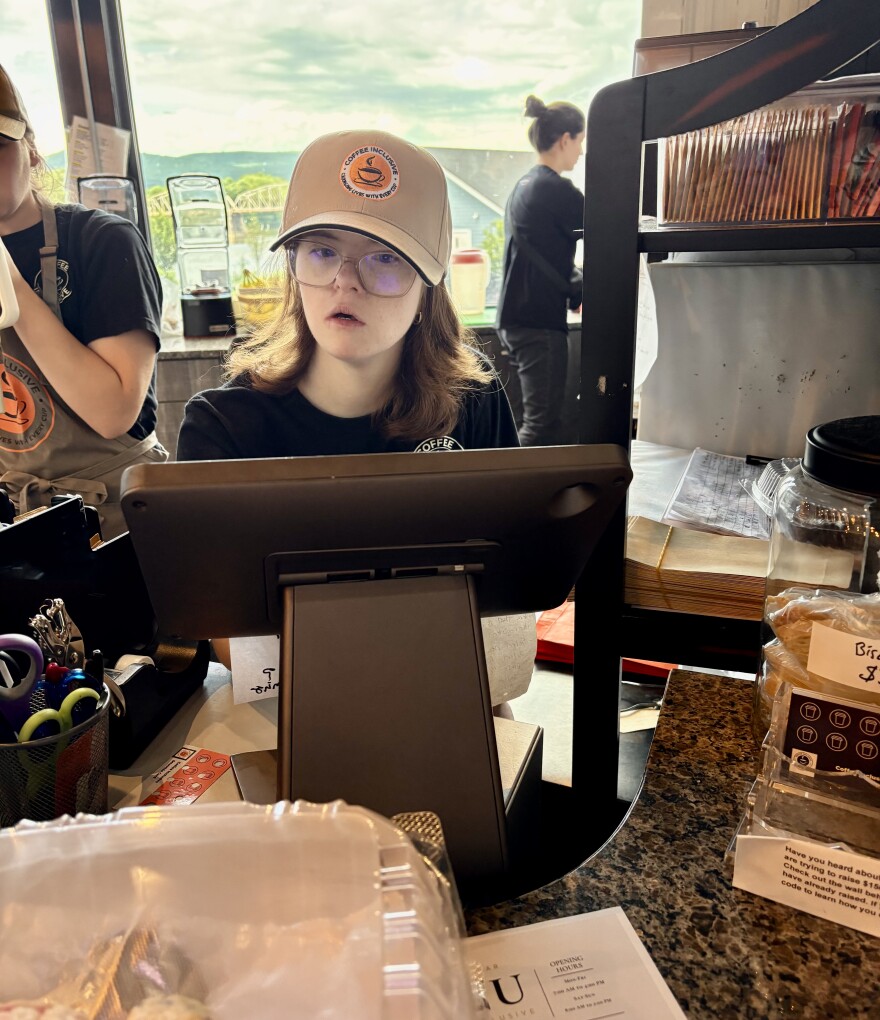Norah Carey takes orders at Coffee Inclusive, a cafe that employs Pennsylvanians with disabilities.