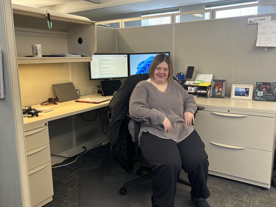 Sara Wolff sits at her desk at MyCIL Centers for Independent Living in Scranton. She works as a an independent living/self-advocacy specialist for people with disabilities.
