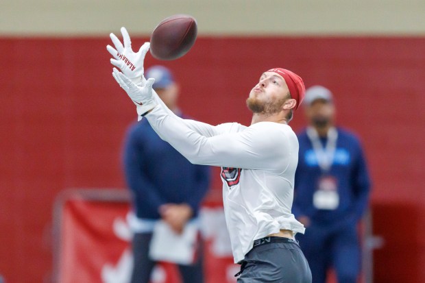 Former Alabama tight end CJ Dippre catches a pass from former Alabama quarterback Jalen Milroe during passing drills at Alabama's NFL football pro day, Wednesday, March 19, 2025, in Tuscaloosa, Ala. (AP Photo/Vasha Hunt)