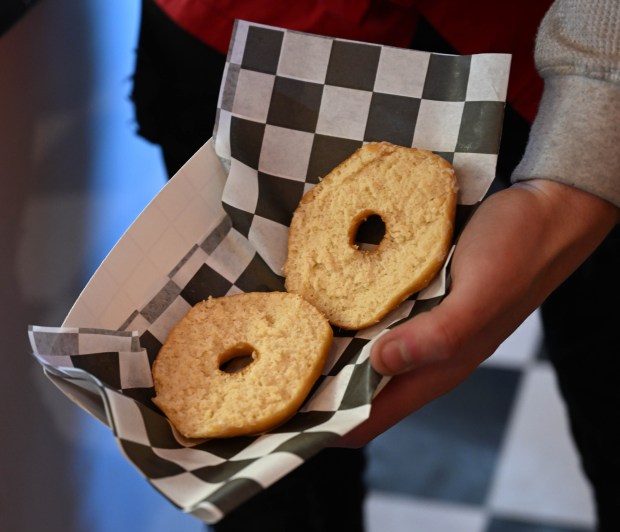 Dylan Garcia creates a doughnut sundae Saturday, Feb. 7, 2026, at Inside Scoop in Coopersburg. The shop featured special ice cream dishes to celebrate National Ice Cream for Breakfast Day. (Amy Shortell/The Morning Call)