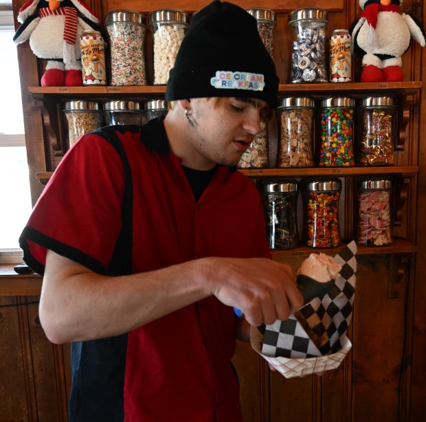 Dylan Garcia creates a waffle sundae Saturday, Feb. 7, 2026, at Inside Scoop in Coopersburg. The shop featured special ice cream dishes to celebrate National Ice Cream for Breakfast Day. (Amy Shortell/The Morning Call)