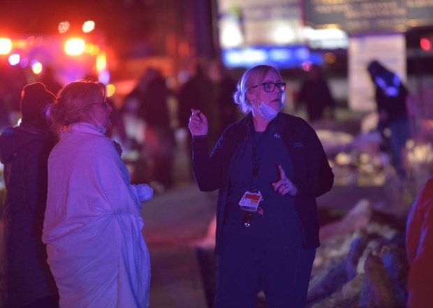 Workers discuss plans outside Lehigh Valley Hospital in Dickson City on Wednesday, Feb. 5, 2026, after a significant fire forced the evacuation of the hospital. (CHAD SEBRING/STAGG PHOTO)