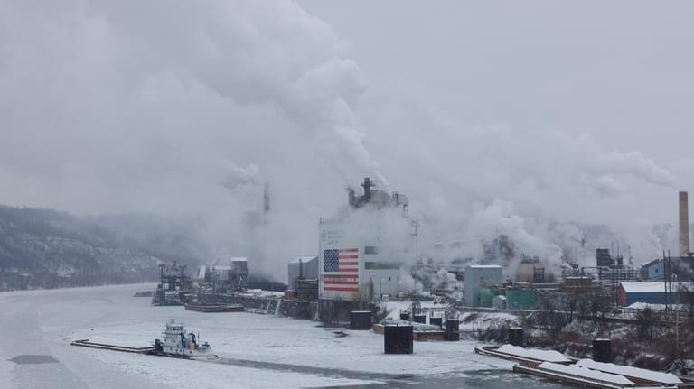 A barge departs along the Monongahela River from U.S. Steel's...
