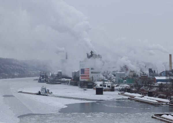 A barge departs along the Monongahela River from U.S. Steel's Clairton Coke Works in Clairton, Pa., on Sunday, Feb. 1, 2026. (Quinn Glabicki/Pittsburgh's Public Source via AP)