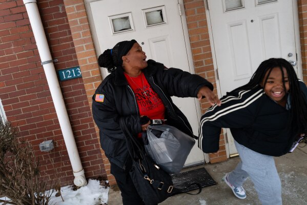 Carla Beard-Owens plays with her granddaughter, Nasyiah Mason, outside their apartment in Clairton, Pa., on Sunday, Jan. 4, 2026. (Quinn Glabicki/Pittsburgh's Public Source via AP)