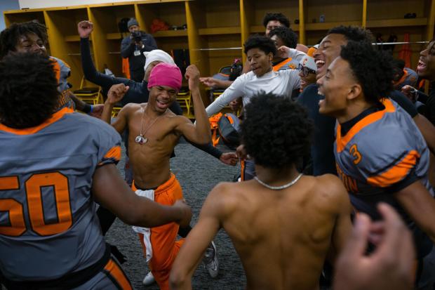 Clairton High School football players celebrate in the locker room after winning the WPIAL Championship at Acrisure Stadium in Pittsburgh, Pa., on Saturday, Nov. 22, 2025. (Quinn Glabicki/Pittsburgh's Public Source via AP)