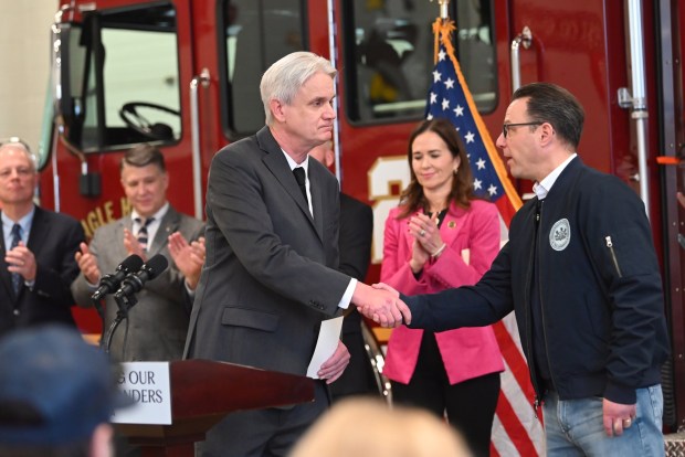 Dickson City Mayor Robert MacCallum shakes hand with Governor Josh Shapiro at Dickson City Fire Department's Eagle Hose Company No. 1 on Tuesday, Feb. 10, 2026. The governor along with Pennsylvania State Fire Commissioner Thomas Cook visited the department to show support to first responders after last week's Lehigh Valley Hospital fire. (REBECCA PARTICKA/STAFF PHOTOGRAPHER)