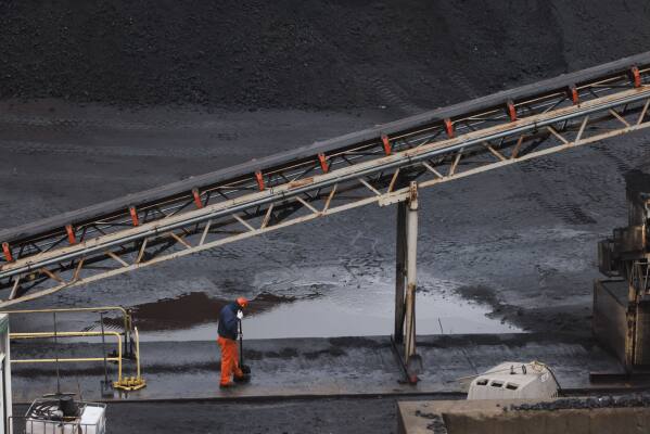 A worker in the coal fields at U.S. Steel's Clairton Coke Works in Clairton, Pa., on Wednesday, Nov. 19, 2025. (Quinn Glabicki/Pittsburgh's Public Source via AP)