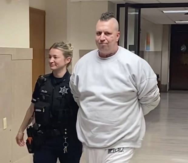 Richard Birkmire, of Bally, Berks County, is escorted by a deputy sheriff from a Montgomery County courtroom on Jan. 21, 2026, to begin a prison term for illegal possession of a firearm. (Photo by Carl Hessler Jr. - MediaNews Group)