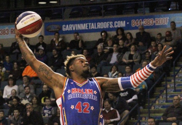 Harlem Globetrotter Spider Sharpless goes for a slam dunk during a game against the Washington Generals at Mohegan Arena in Wilkes-Barre Twp. (FILE)