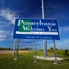 Welcome to Pennsylvania sign at the Pennsylvania/New York state line along Interstate 90.