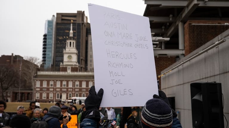 Attendees gather for a rally celebrating the reinstallation of a...