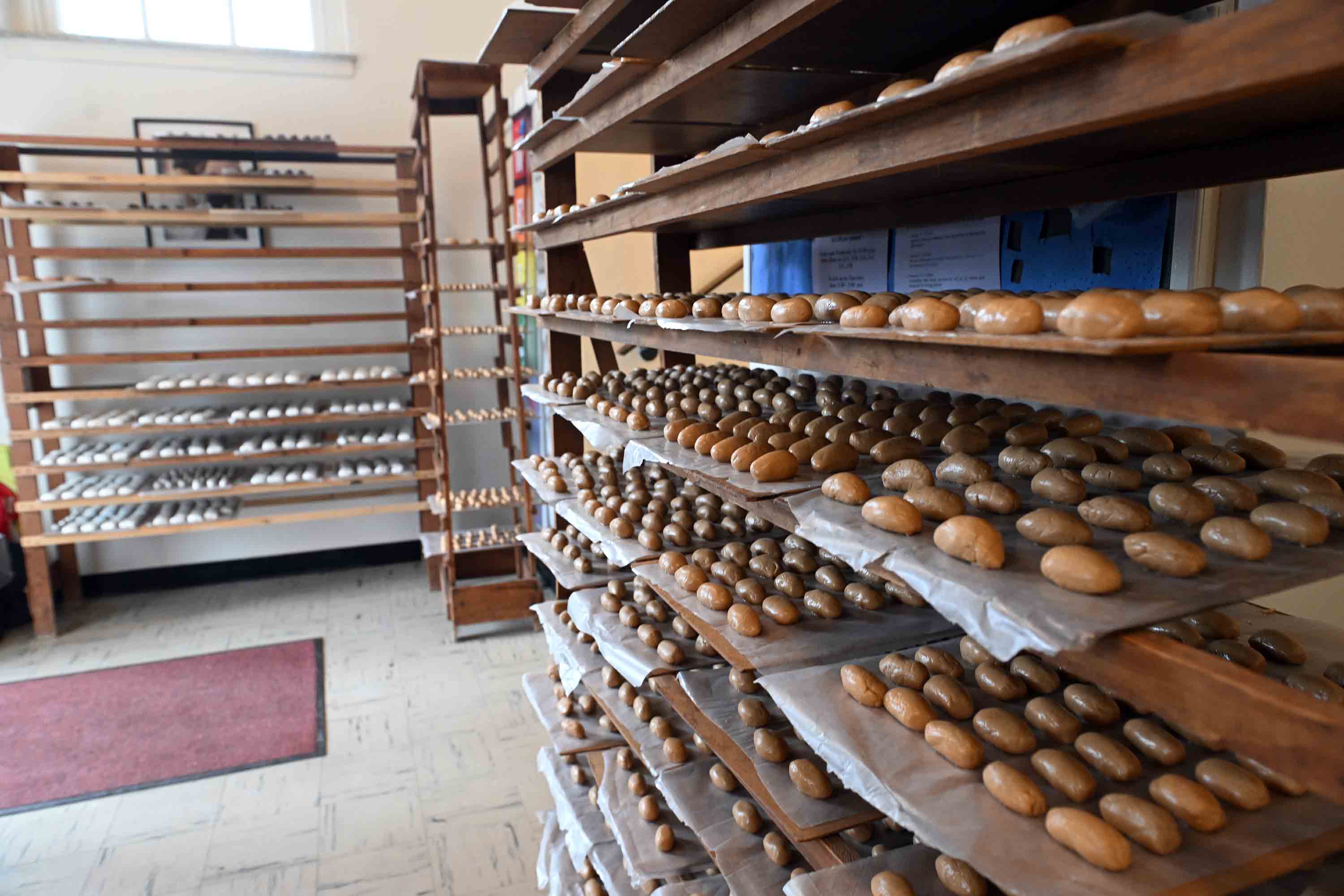 Peanut butter Easter eggs cool before being coated in chocolate...