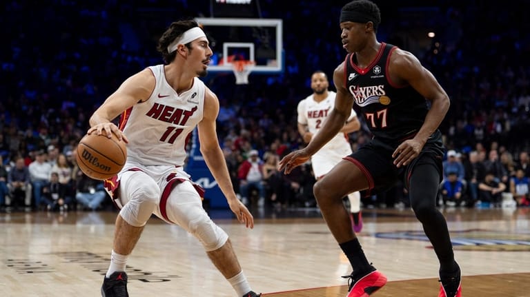 Miami Heat's Jaime Jaquez Jr., left, looks to make his...