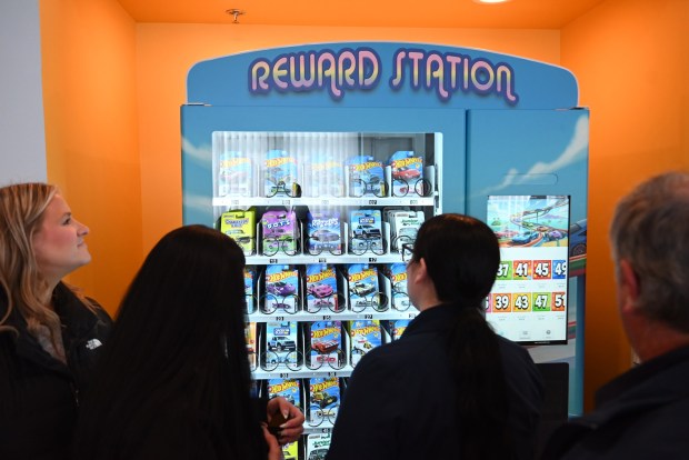 Guests check out the "Reward Station", a vending machine with toys, in the Ronald McDonald House Family Room at the John P. Moses, Esq. Pediatric Rehabilitation Center in Scranton on Friday, Feb. 27, 2026. (REBECCA PARTICKA/STAFF PHOTOGRAPHER)