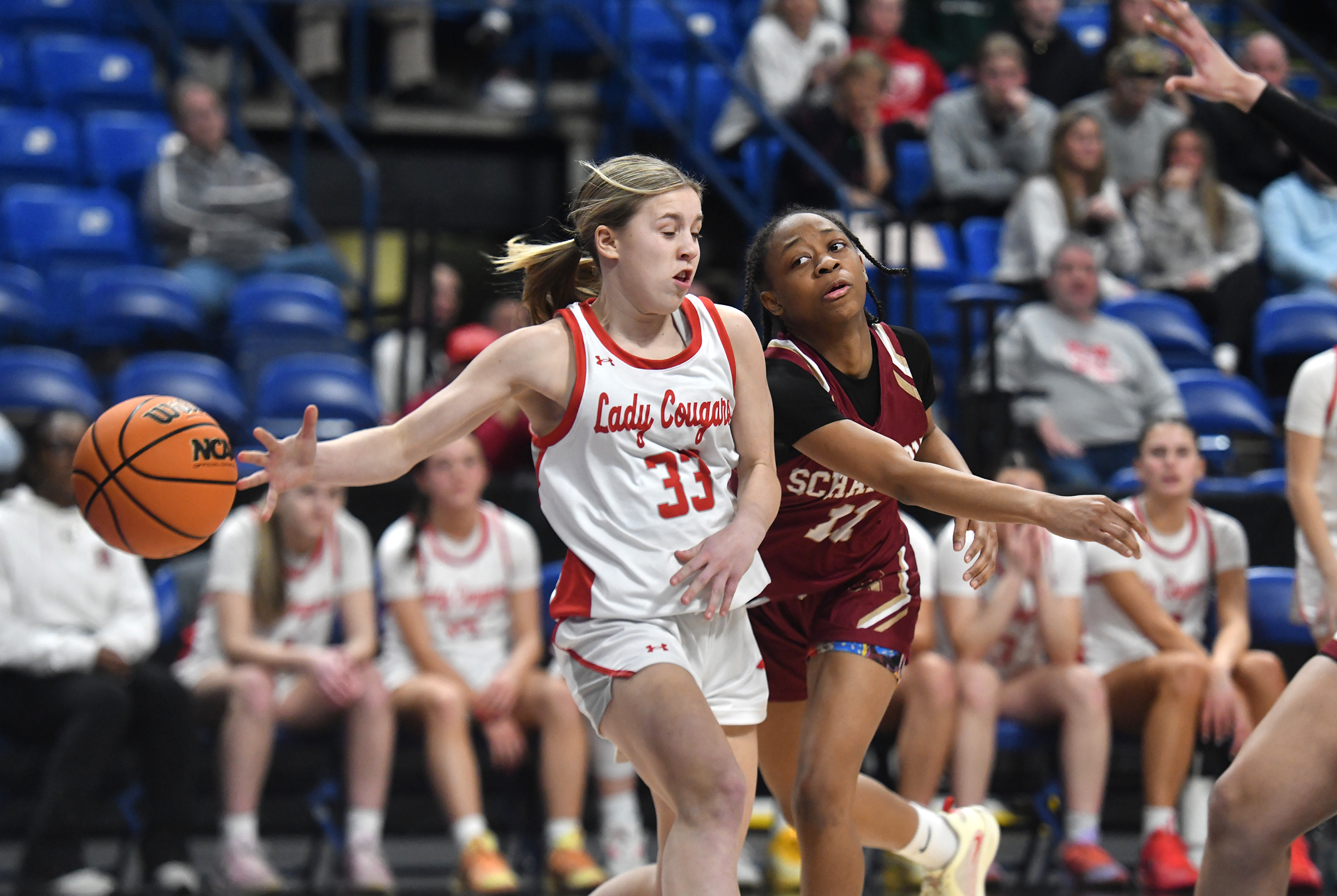 Hazleton Area’s Anna Shafer (33) and Scranton’s Jahiya Parker battle...