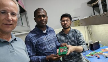 From left to right, Kevin Czajkowski, Olawale Oluwafemi, and Md. Faisal Karim displaying the STELLA-inspired sensor just after it had passed inspection at Near Space Launch.