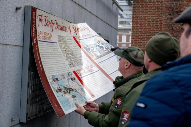 Workers remove the displays at the President' s House site in Independence National Historical Park Thursday, Jan. 22, 2026. (Tom Gralish/The Philadelphia Inquirer/TNS)