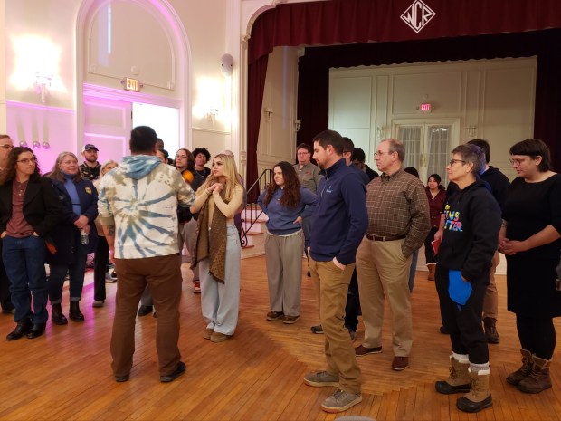 Daniel Egusquiza, Barrio Alegria executive director, gets participants on their feet during a meeting at the WCR Center for the Arts, 140 N. Fifth St., on Thursday, Jan. 29, 2026, about redesigning the Reading Gateway Bridge . (MICHELLE LYNCH/READING EAGLE)