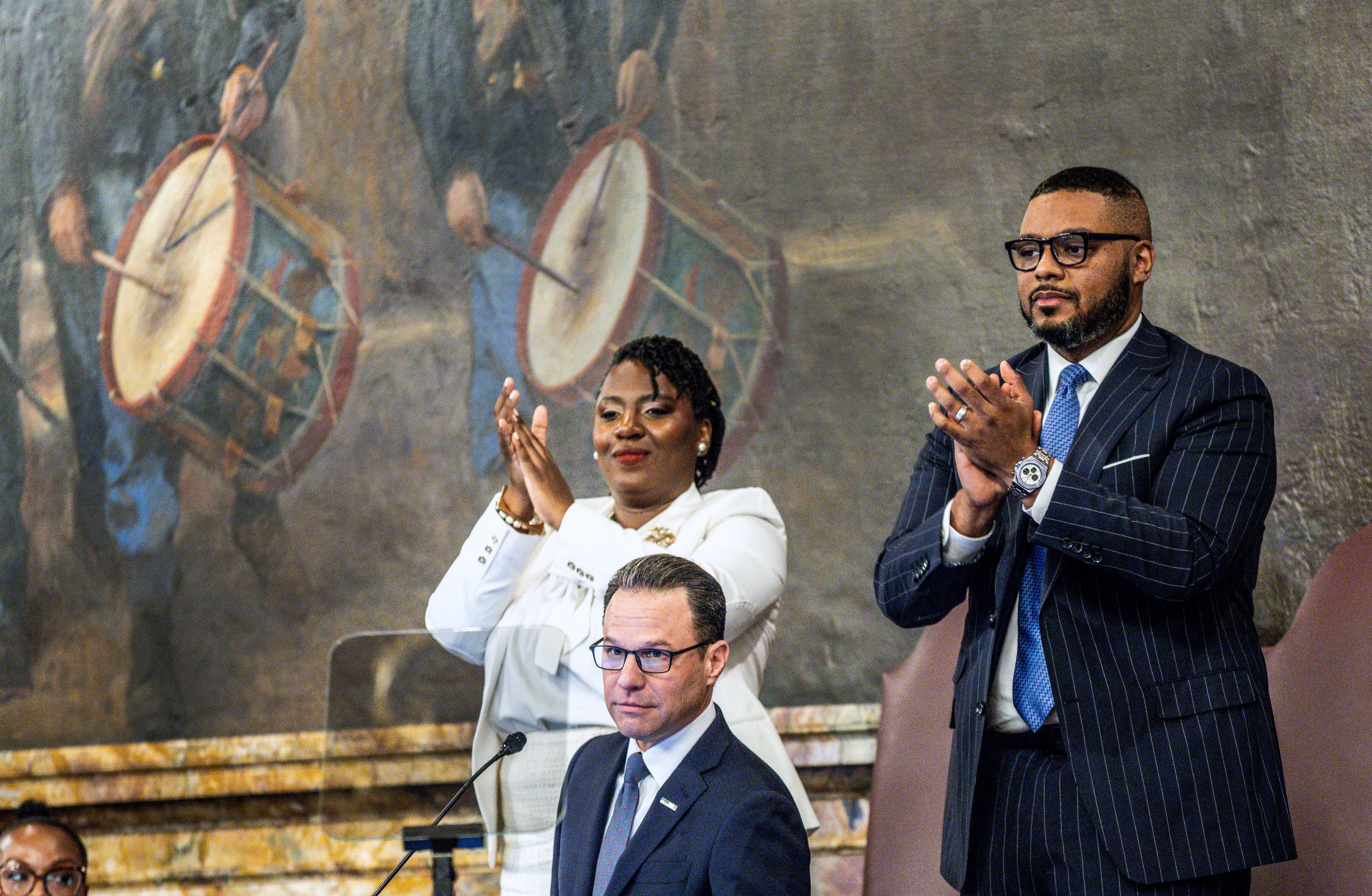 House Speaker Joanna McClinton and Lt. Gov. Austin Davis applaud...