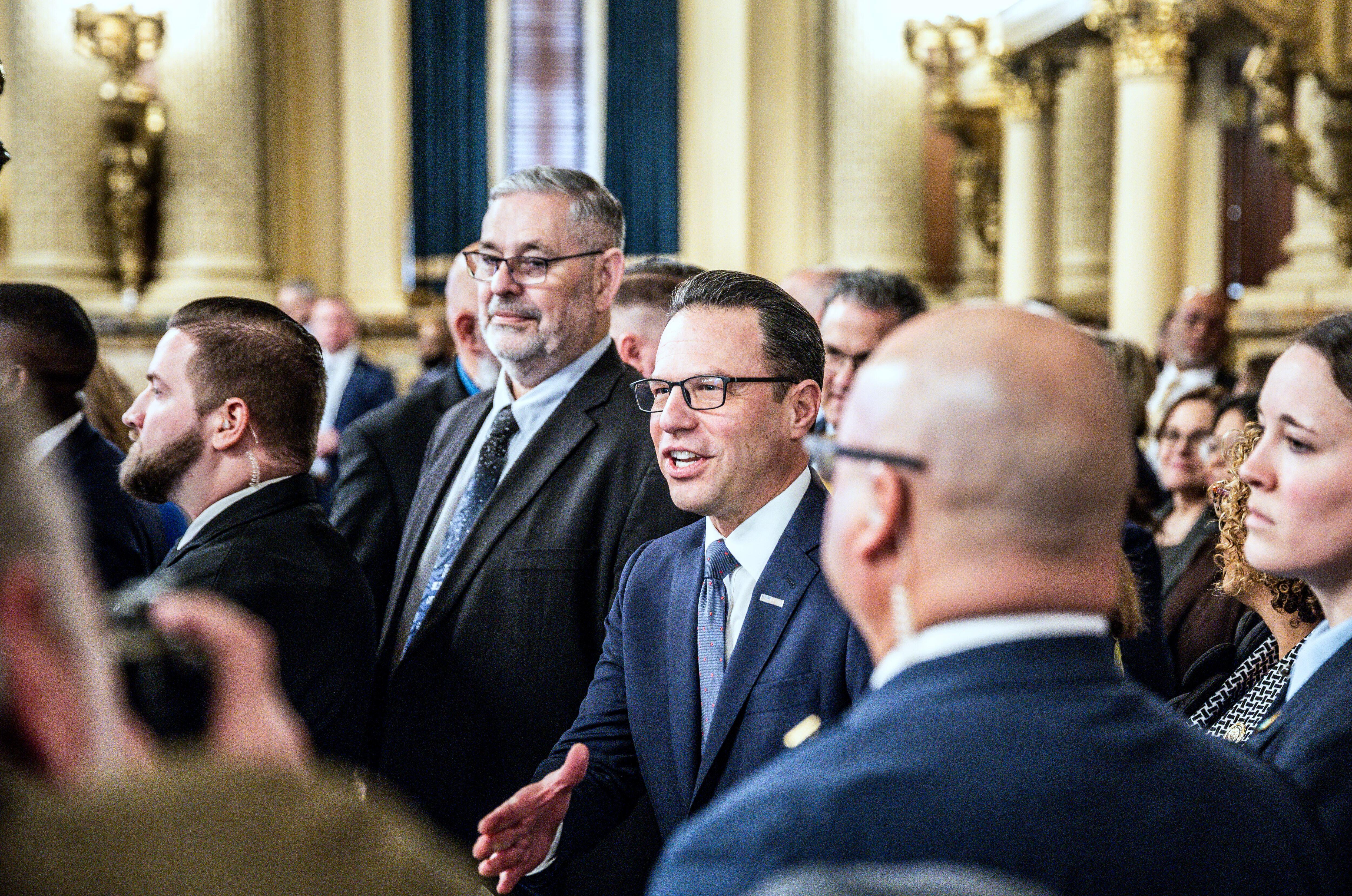 Gov. Josh Shapiro greets lawmakers prior to delivering his 2026-27...
