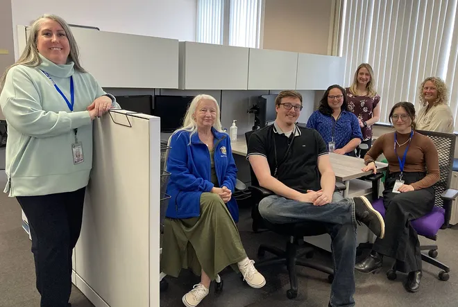 Erin Mrenak, left, Erie County Department of Health director, stands with members of the health department's rapid response team who helped contact trace people exposed to measles during the 2025 outbreak.